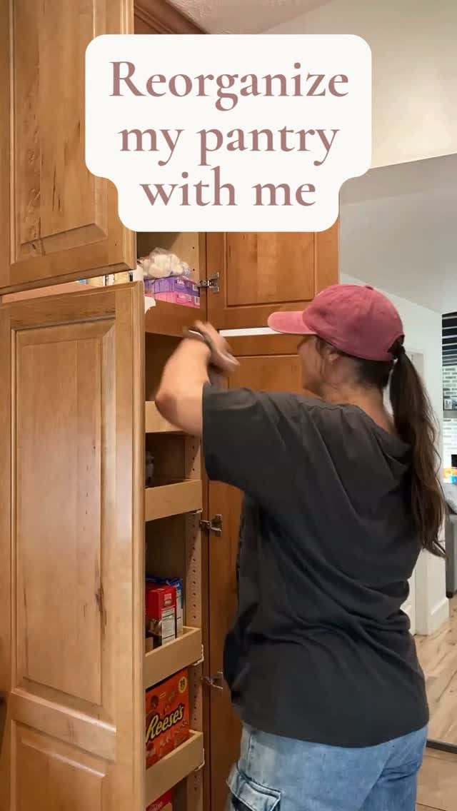Professional organizer arranging pantry shelves