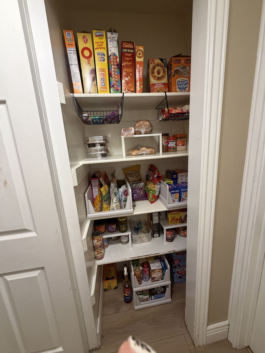 Pantry organized into clear categories after an Edited Spaces project